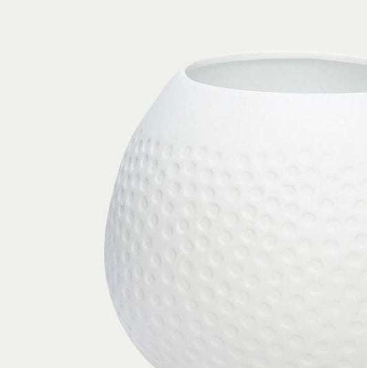 Close up of a Hubsch Interior coral tea light holder in white porcelain on white background