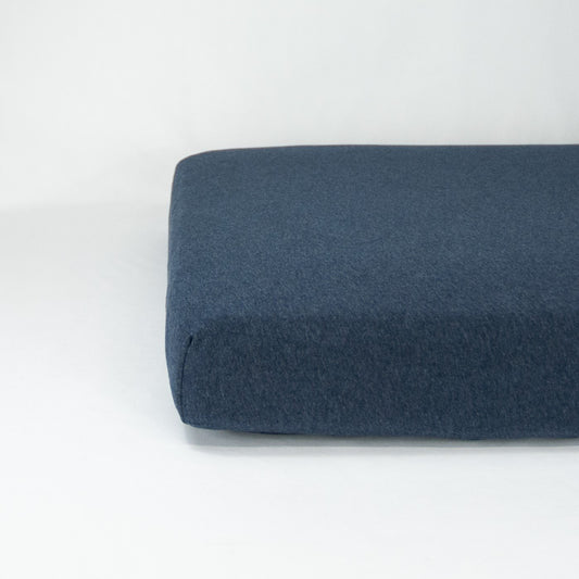 End of mattress with organic jersey fitted cot sheet in cloud grey