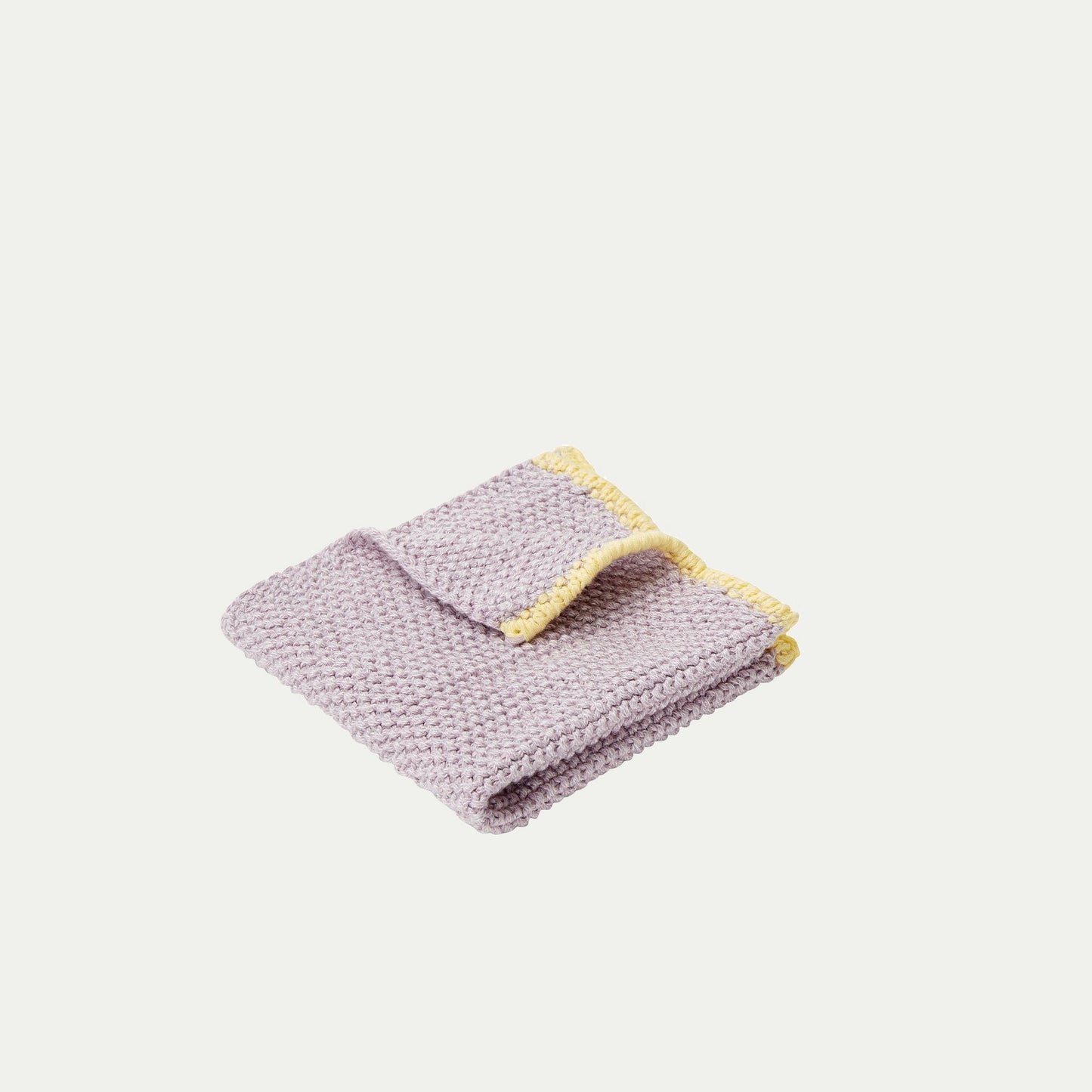 Hubsch Interior Scandi designer dish cloth in lilac purple and yellow cotton knit on a white background