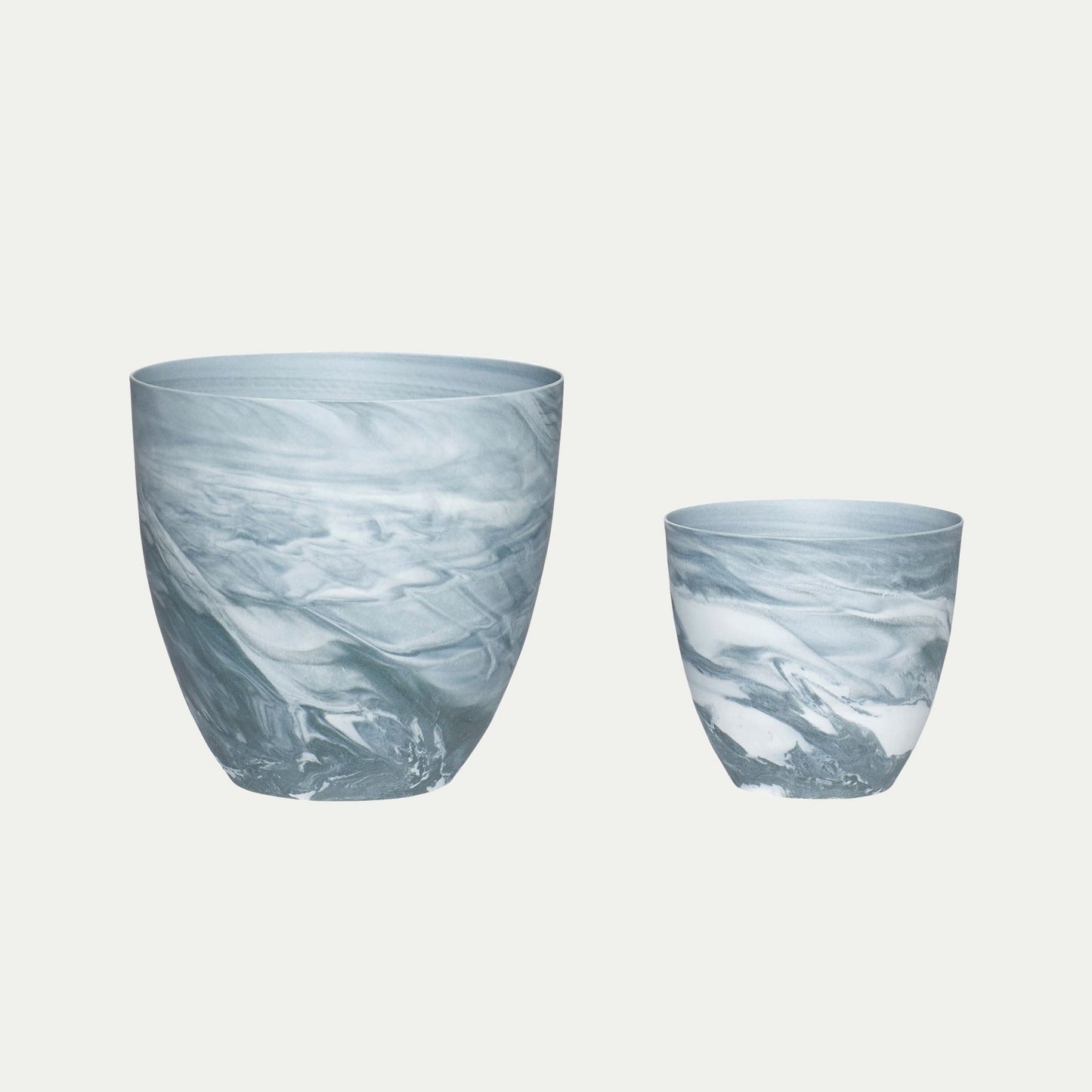 Hubsch Interior marble tea light holder set in dark grey and white on white background