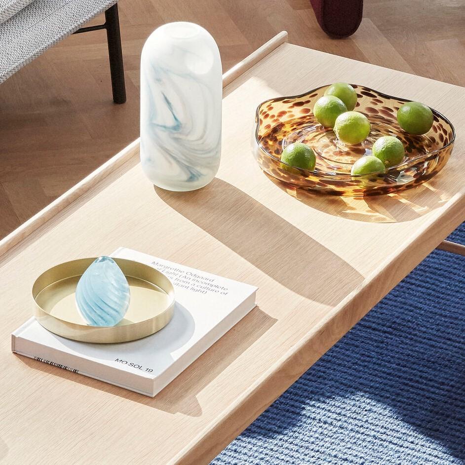Hubsch Interior Scandi style marbled vases in white and blue glass sitting on coffee table with glass bowl and books