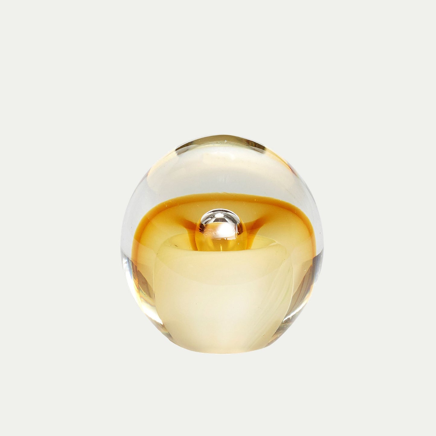 Hubsch Interior objet d’art paperweight in honey amber and cream on white background