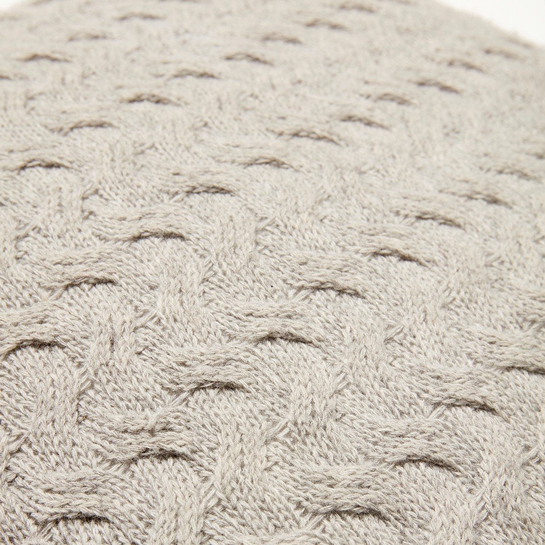 Close up of a Hubsch Interior 50x50 wool cable knit cushion in pale grey on white background