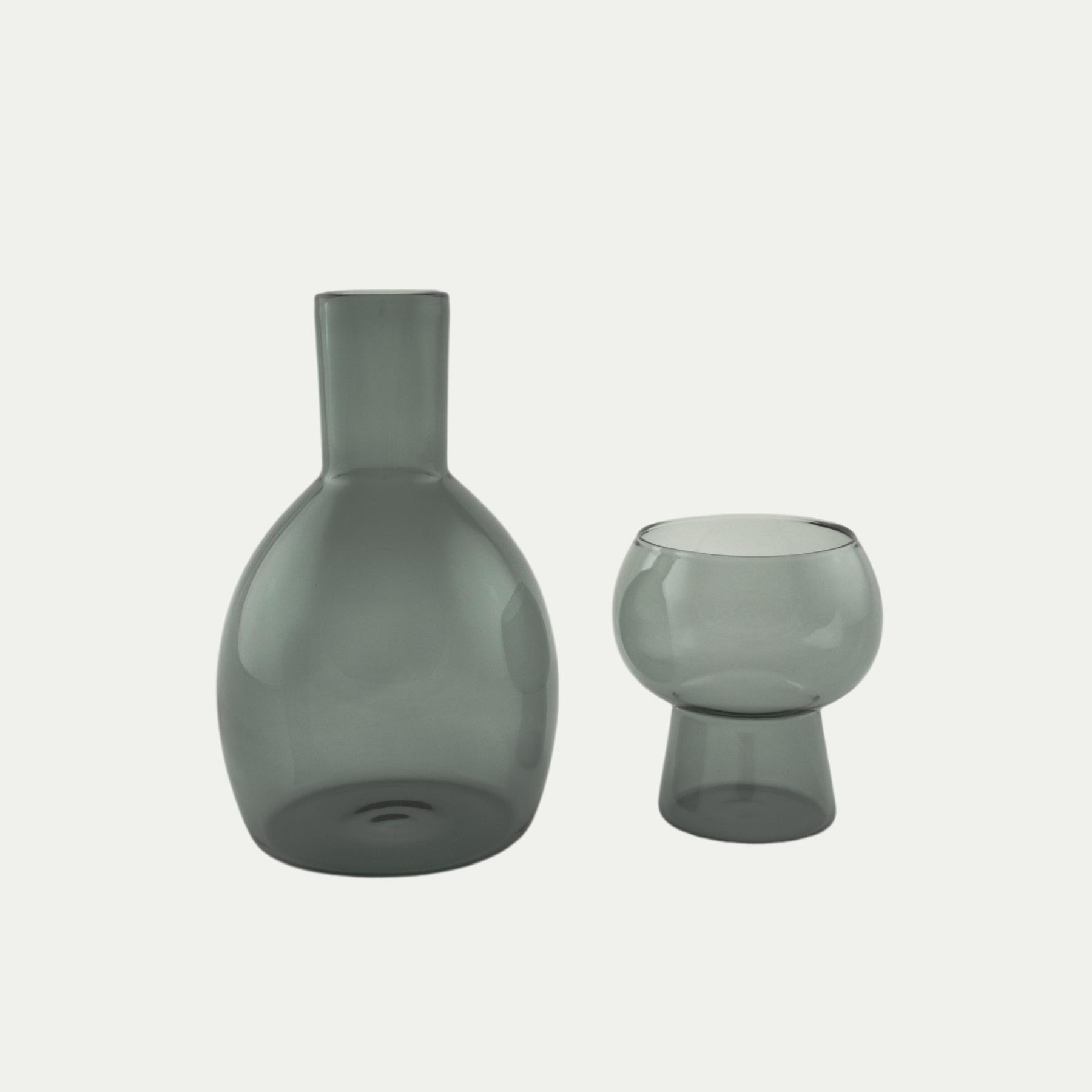 Coco and Henry Marnie carafe and stemless wine glass side by side, smoke grey coloured, made from borosilicate glass