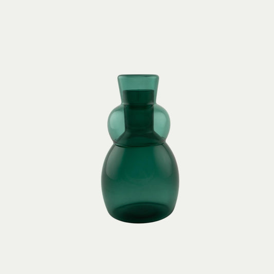 Coco and Henry Marnie carafe and stemless wine glass stacked on top, teal green coloured, made from borosilicate glass